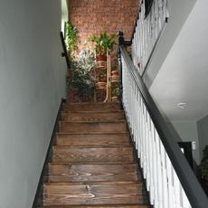 hallway with brick wall