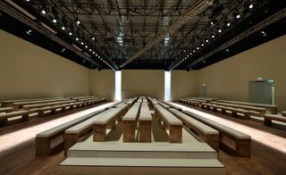 cushioned, wooden benches & hard wood floors at the Salvatore Ferragamo show space located at the Piazza Affari