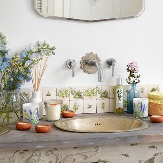 white bathroom with flower plants and sink