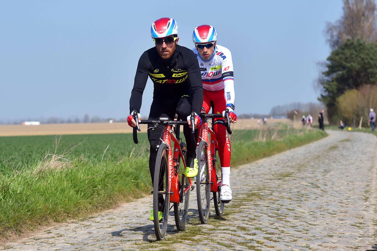 Luca Paolini and Alexander Porsev train on the pav&eacute;