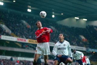 Manchester United defender Ronny Johnsen jumps for a header in a game against Tottenham at White Hart Lane in December 1998.