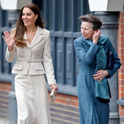 Princess Anne and Princess Kate walking down a street and smiling