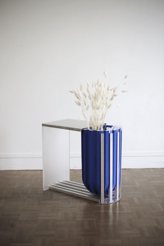 Side table with signature blue object