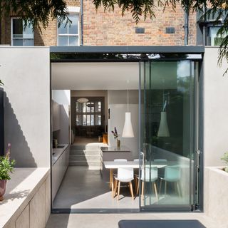 patio area with dining table and glass door