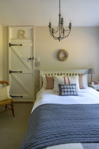 guest room with white bed and pillows
