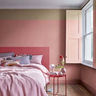 Pink bedroom with red painted headboard