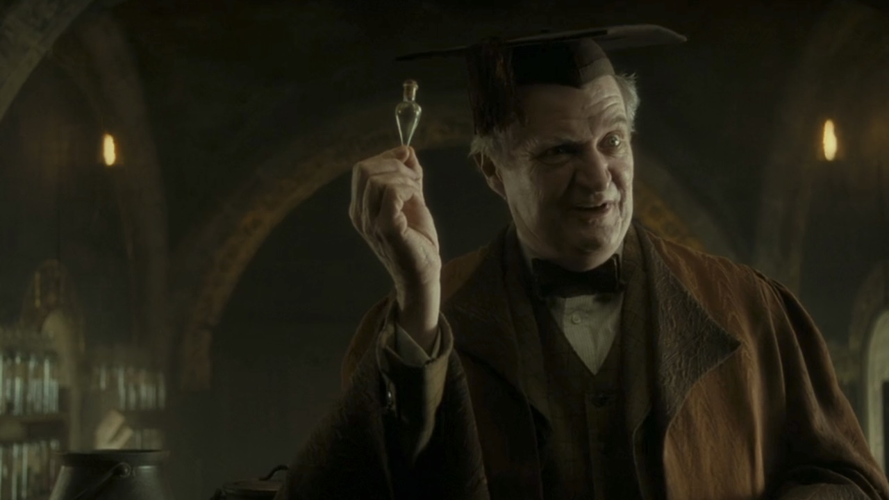 Prof. Slughorn holding up a vial of felix felicis potion in Harry Potter and the Half-Blood Prince