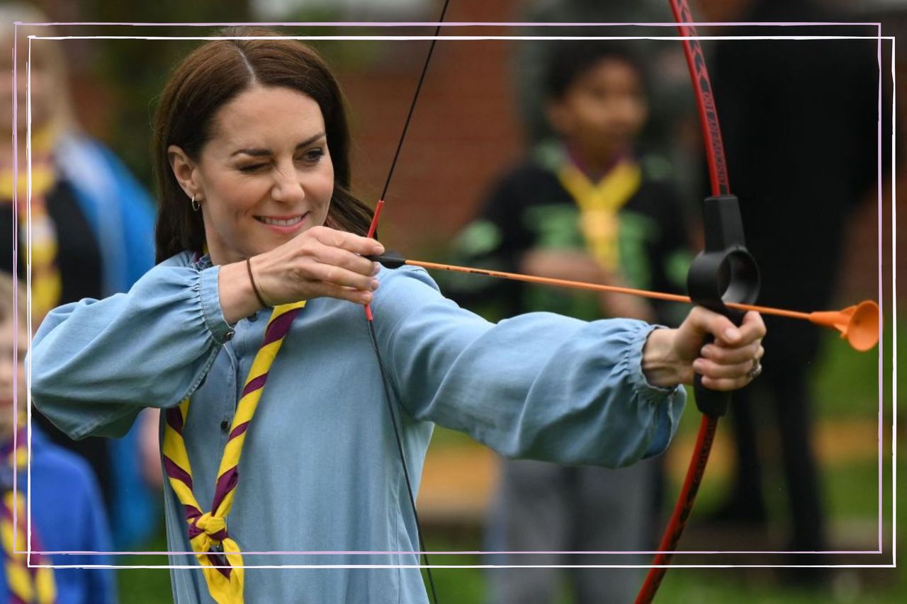 Britain&#039;s Catherine, Princess of Wales, tries her hand at archery while taking part in the Big Help Out, during a visit to the 3rd Upton Scouts Hut in Slough, west of London on May 8, 2023