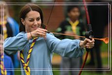 Britain's Catherine, Princess of Wales, tries her hand at archery while taking part in the Big Help Out, during a visit to the 3rd Upton Scouts Hut in Slough, west of London on May 8, 2023