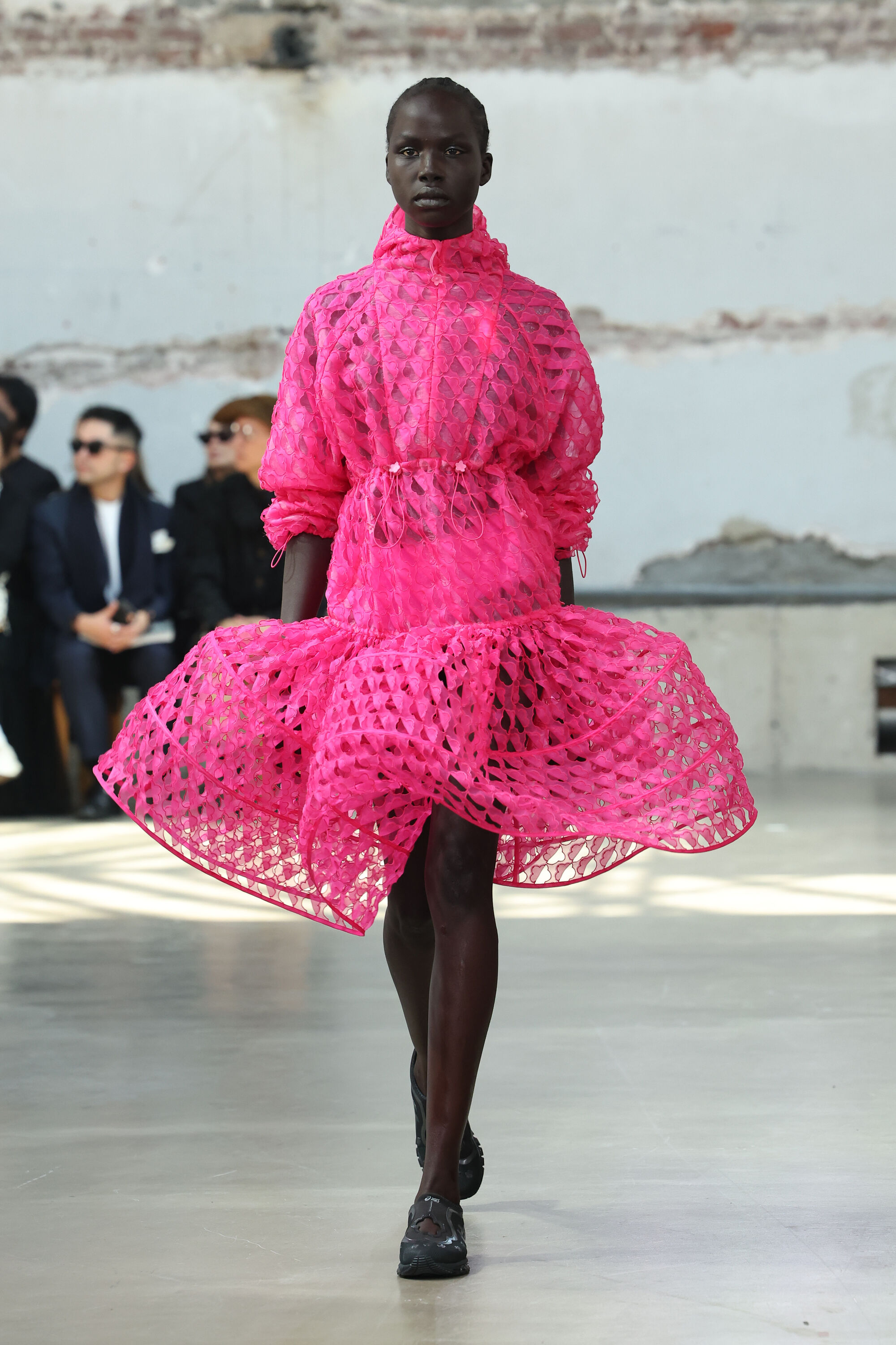 voluminous pink dress on a runway