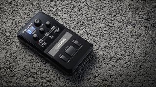 Boss Pocket GT on a grey stone floor