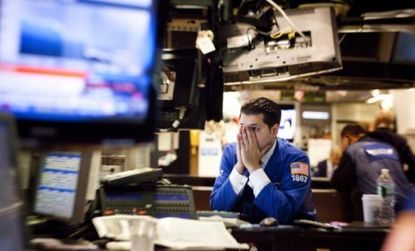 A trader looking concerned on the New York Stock Exchange: Europe's debt crisis is causing many to question whether stocks have lost their security.