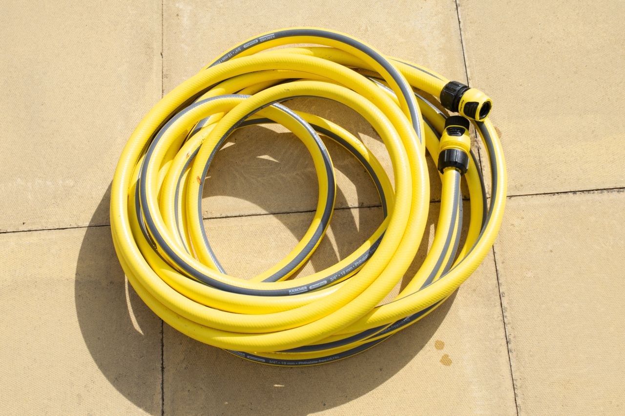 A yellow Karcher K2 Pressure washer hose