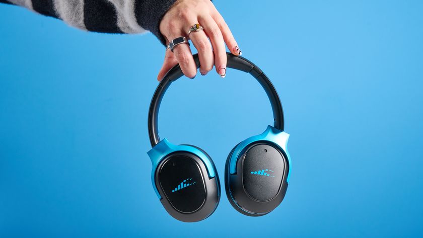 H2O RIPT Ultra headphones in black with blue accents photographed on a blue background