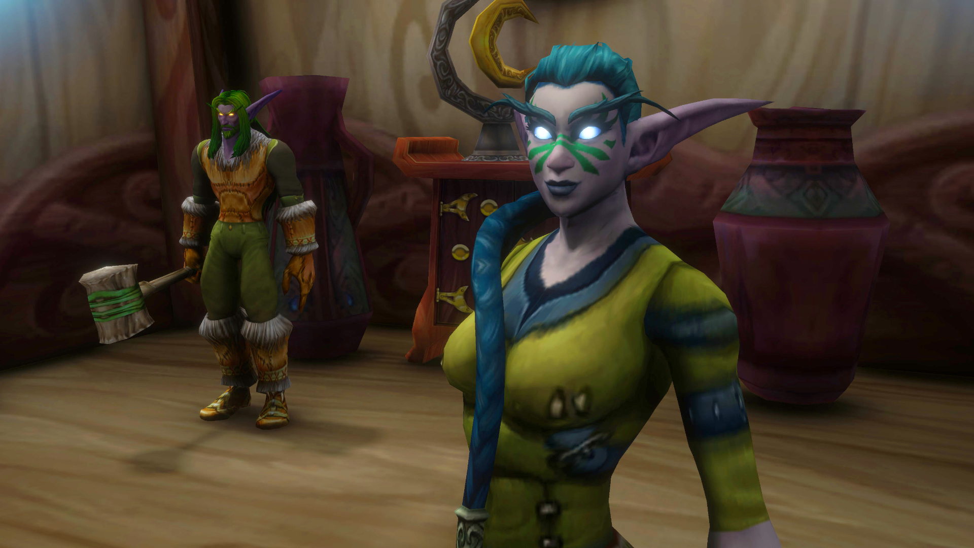 A screenshot of the World of Warcraft: Forever beta. A blue-haired Night Elf stands in the foreground with a green-haired ally in the background.