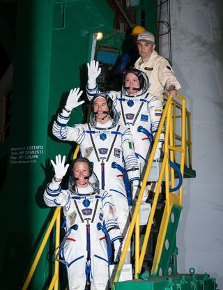 Expedition 36 Crew Waves While Heading to the Rocket