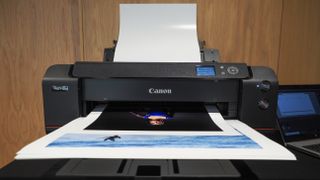 Canon ImagePrograf Pro-1100 printer in a wooden-interior studio, printing photographs