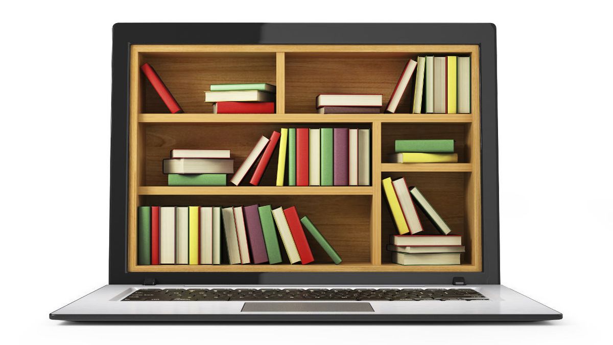 A bookshelf full of books takes the place of the screen in an open laptop computer.