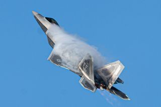 Air Force Capt. Samuel "RaZZ" Larson, F-22 Raptor Demonstration Team commander and pilot, performs an aerial maneuver during the team's certification flight at Joint Base Langley-Eustis, Virginia, Dec. 9, 2022. An F-22 jet took out a Chinese balloon with a Sidewinder missile on Feb. 4, 2023, off the coast of South Carolina.