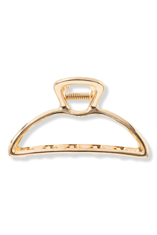 gold claw clip on a white background