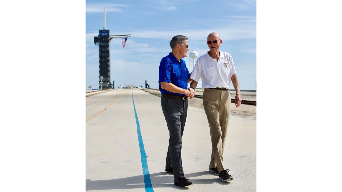 Astronaut Michael Collins (right) and NASA Kennedy Space Center Director Bob Cabana (left) shake hands at Launch Complex 39A on the 50th anniversary of the Apollo 11 launch, July 16, 2019.