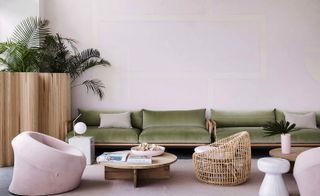A green leather sofa in living area.