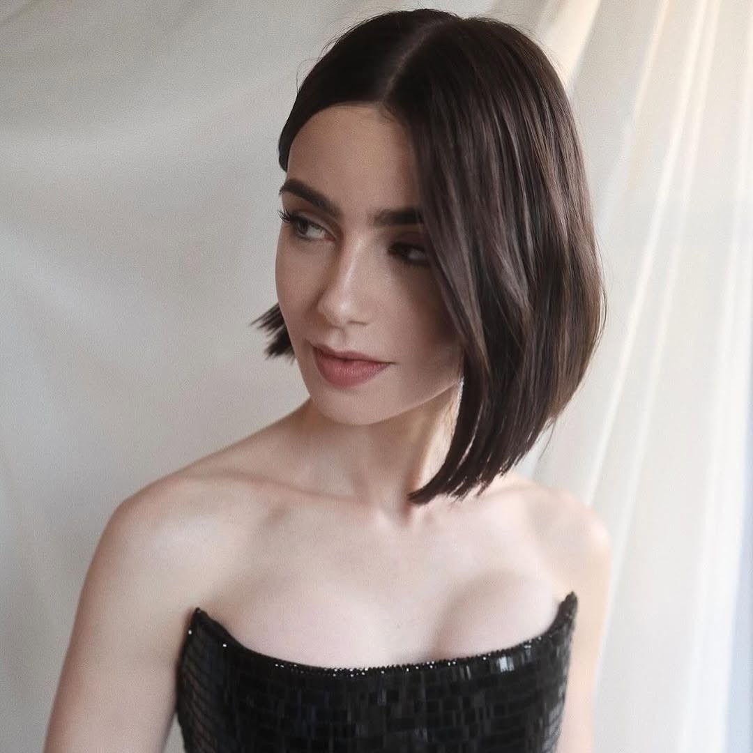 Lily Collins shows off her dark suede brunette hair color.
