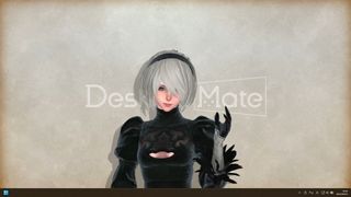 Nier Automata's 2B smiles into the camera while standing in front of a plain cream screen and the Desktop Mate logo.