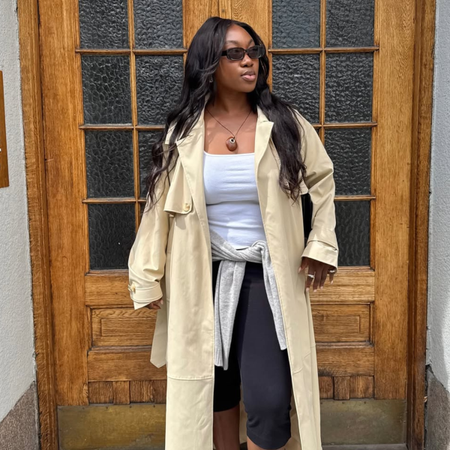 Nnenna in a trench and capris