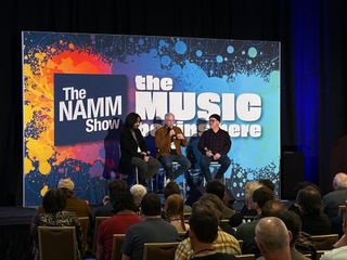 (from left) Mateus Asato, Rick Beato, and Tim Pierce speak at a panel at the 2025 NAMM show in Anaheim, California