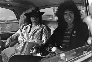 Fredie Mercury and Brian May in a limousine