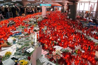Candles and flowers cover the floor of the Atocha Railway Station in Madrid following the 2004 bombing.