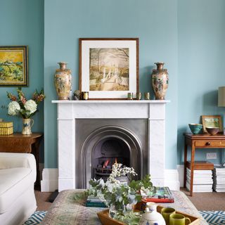 blue living room with open fireplace