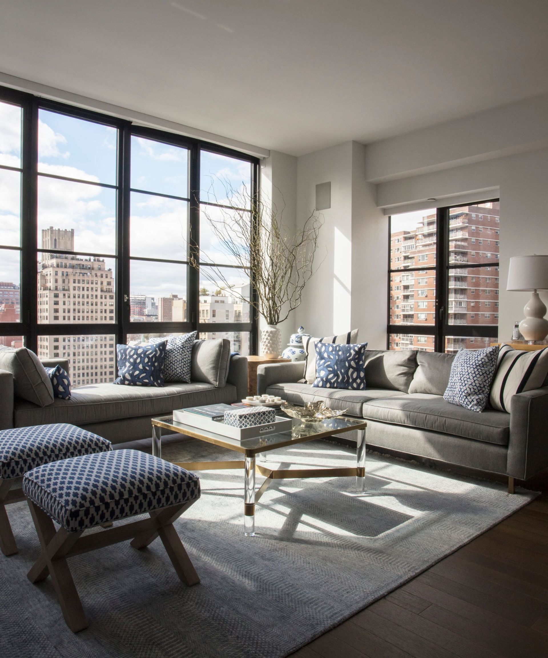 Open plan living room with large windows