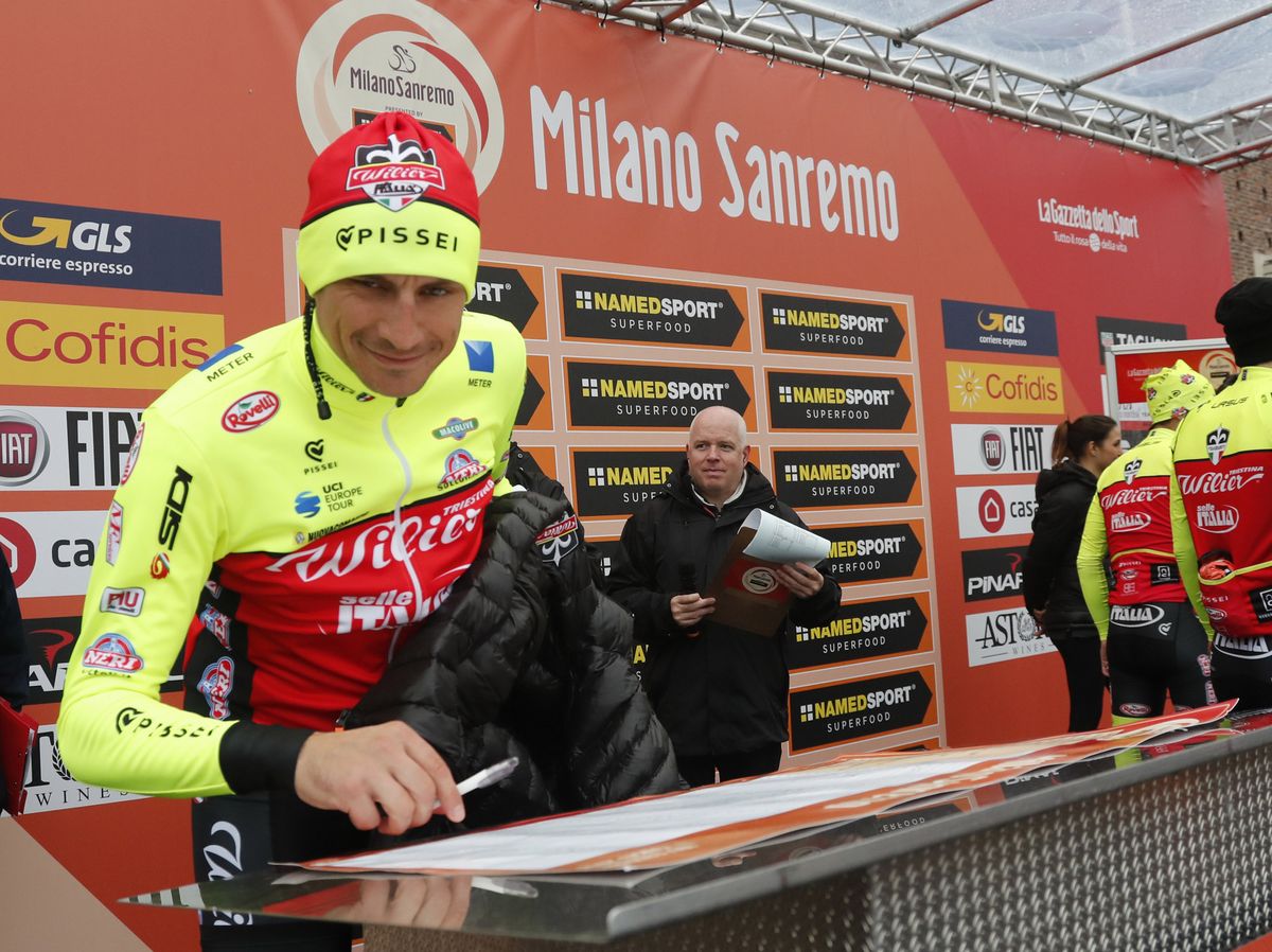 Former winner Filippo Pozzatto signs his name