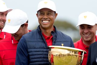 Tiger holds the trophy