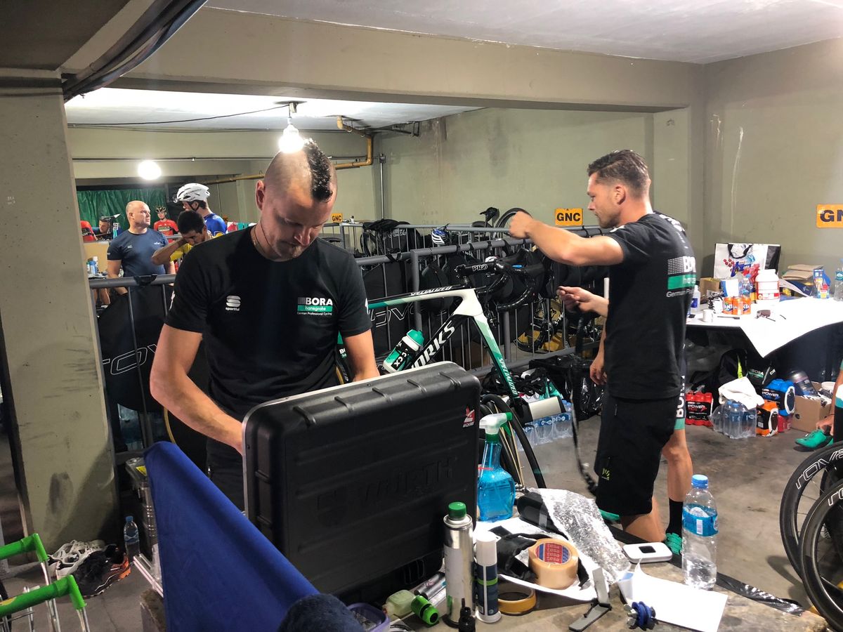 Bora-Hansgrohe mechanics work on the team's Specialized Tarmacs