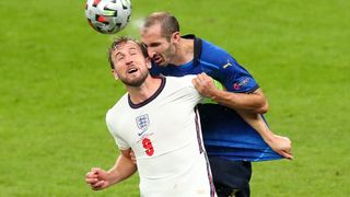 Harry Kane of England and Giorgio Chiellini of Italy challenge for a header during Italy vs England 