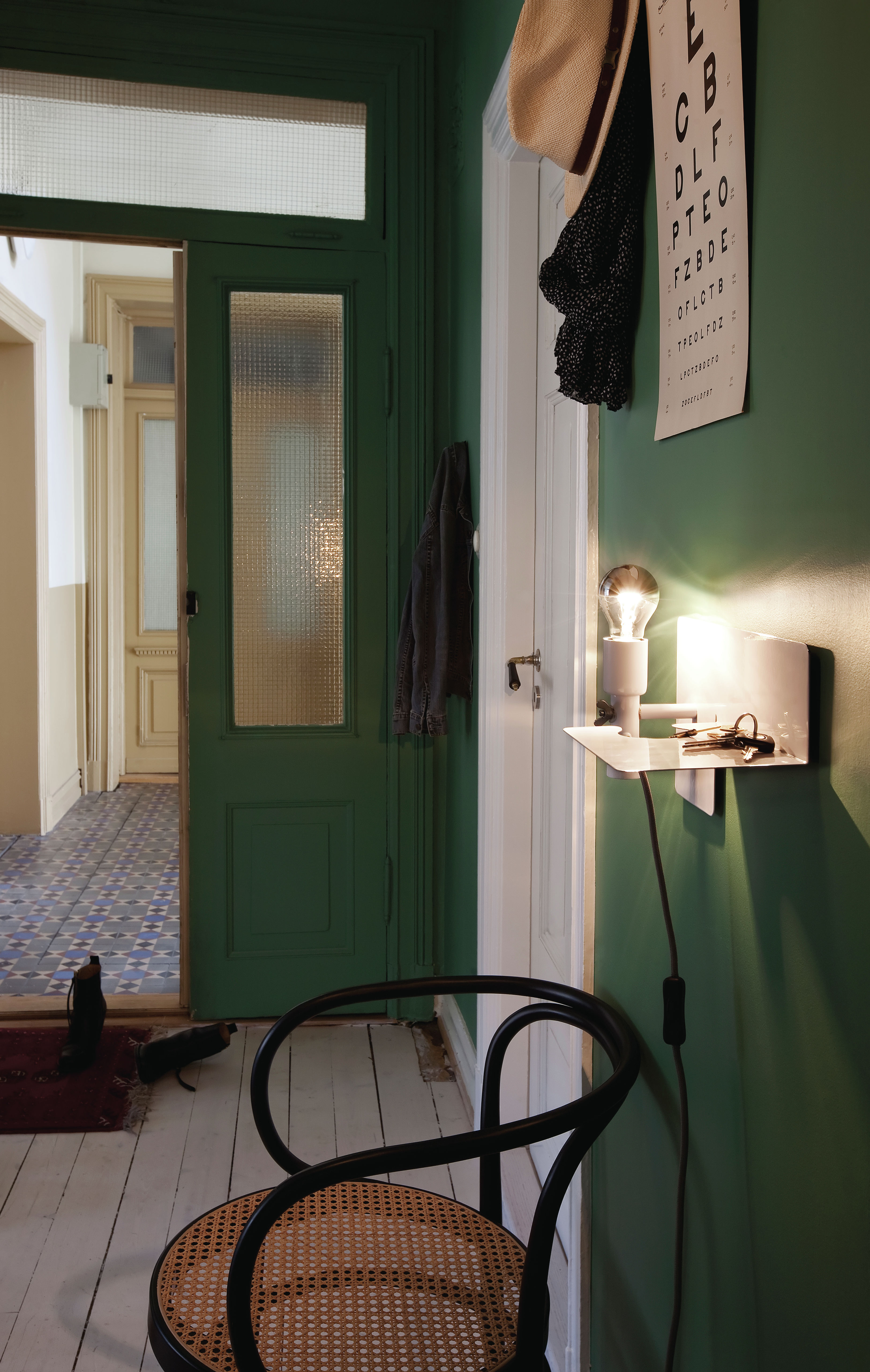hallway ideas: dark green hallway packed with personality