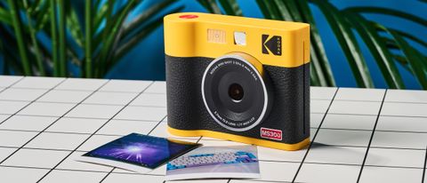 A black and yellow Kodak Mini Shot 3 Era 2-in-1 instant camera and printer