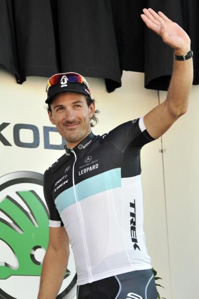 Race leader Fabian Cancellara arrives on stage for the jersey ceremony.