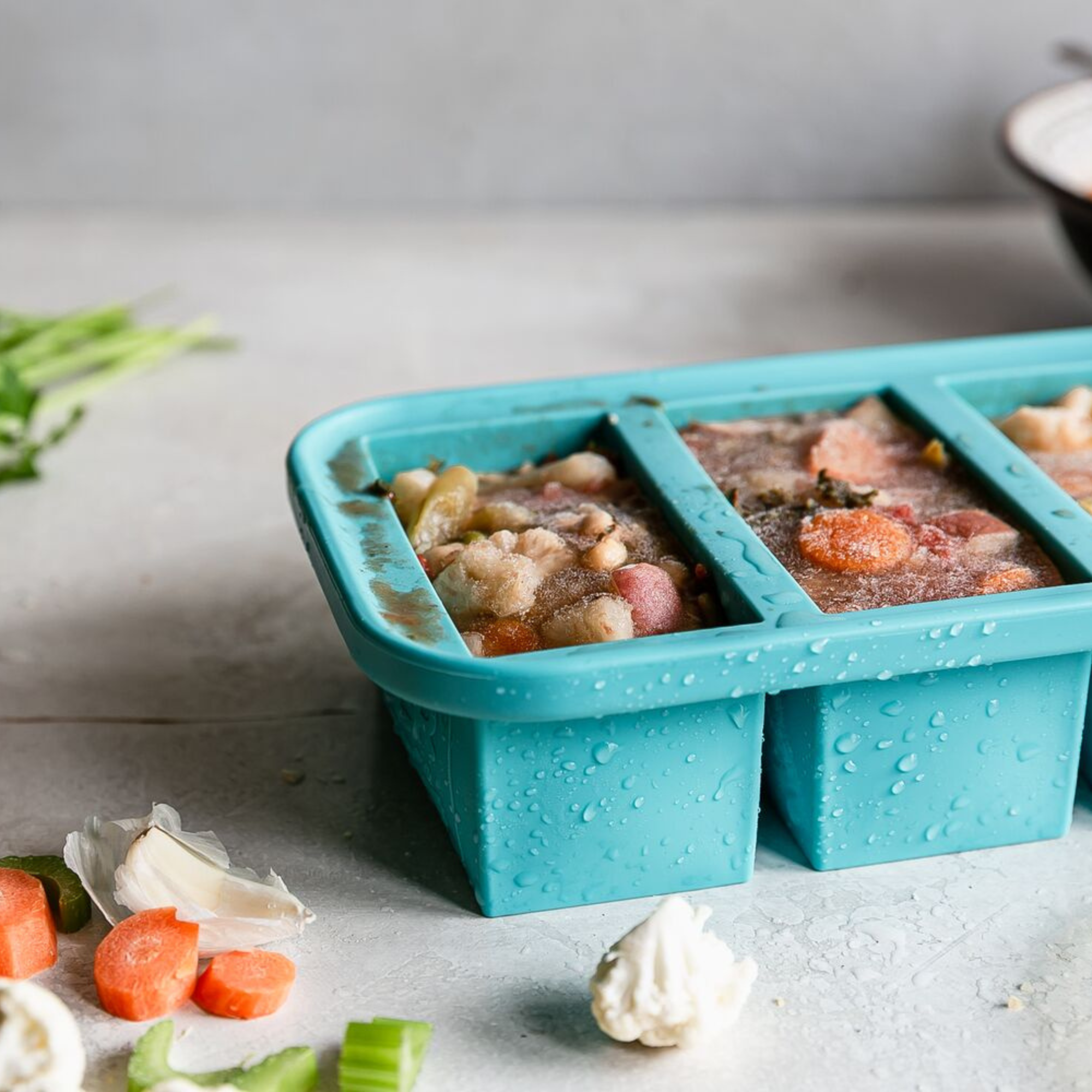 Blue Souper Cube holding frozen chili.