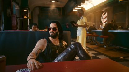 Johnny Silverhand sitting in a diner during one of the best Switch 2 games, Cyberpunk 2077 Ultimate Edition
