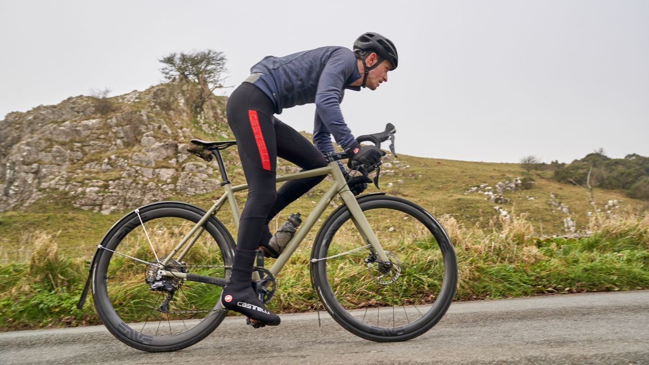 Male cyclist wearing a set of quality bib tights on an outdoor bike ride in the winter