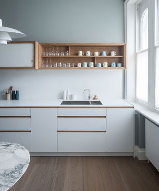 Design a kitchen sink with blue kitchen