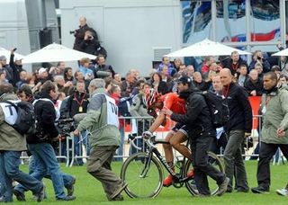 Cancellara can finally relax, or collapse, on the infield of the Roubaix velodrome.