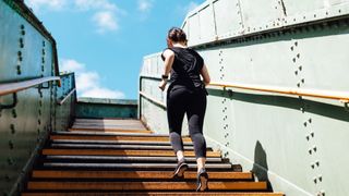 Running to lose weight: Image of woman running up subway stairs