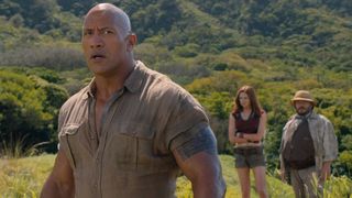 Dwayne Johnson takes a deep breath in an open field in Jumanji: Welcome to the Jungle