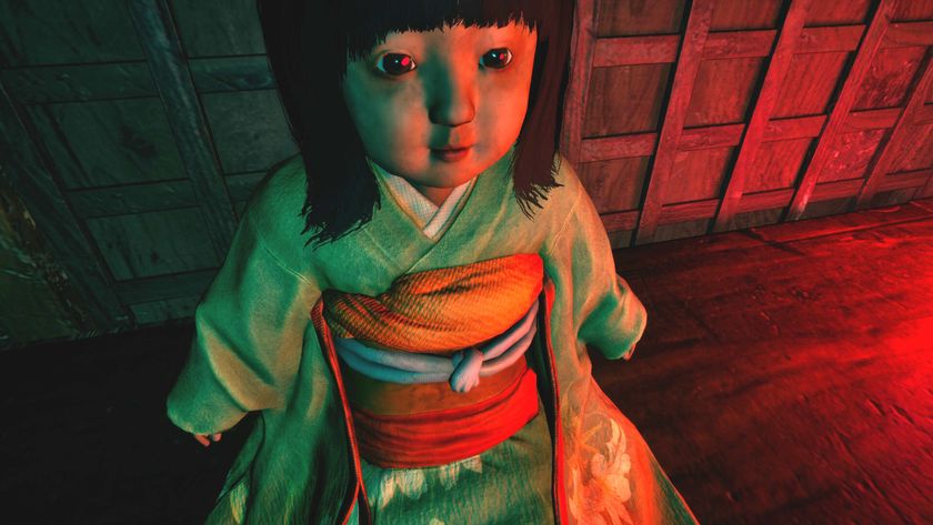 A doll with dark hair sits on a table and stares