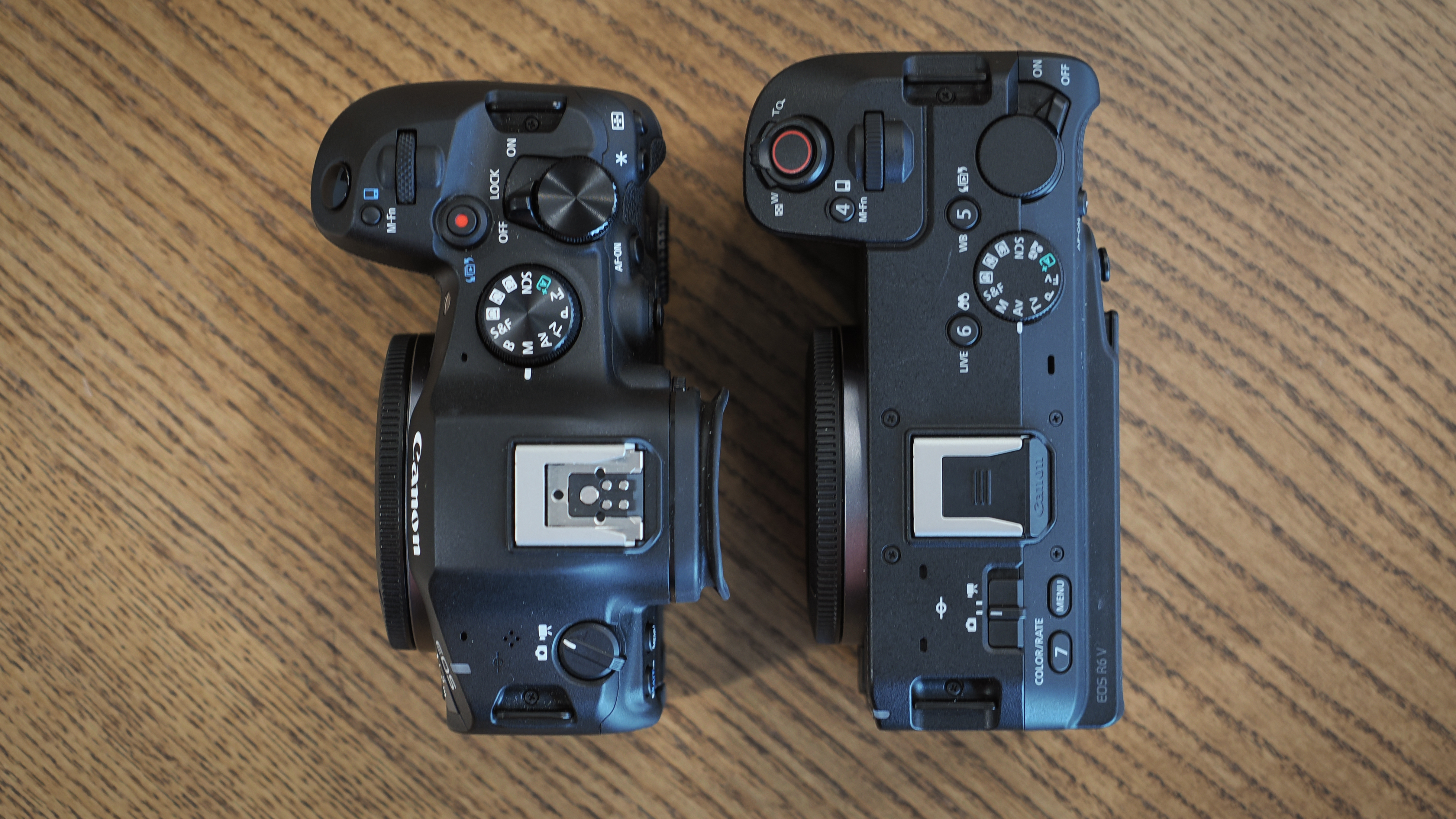 Canon EOS R6 V and R6 Mark III on a wooden surface